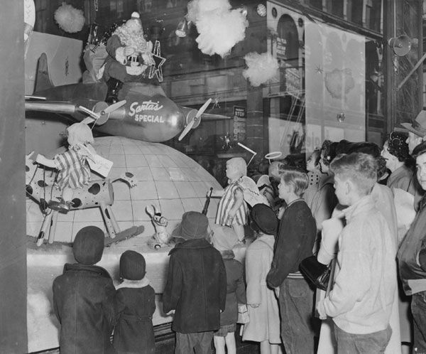 Shoppers look at the Stix, Baer & Fuller window in downtown St. Louis in 1953